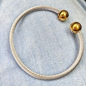 Stainless twist bangle with gold balls